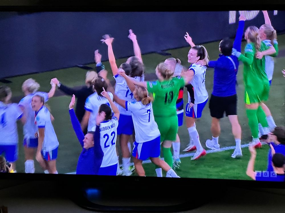 The England women’s football team celebrating after beating Spain on penalties in the Euro finals. 