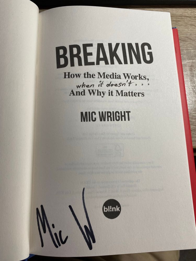 The inside of the book signed by Mic