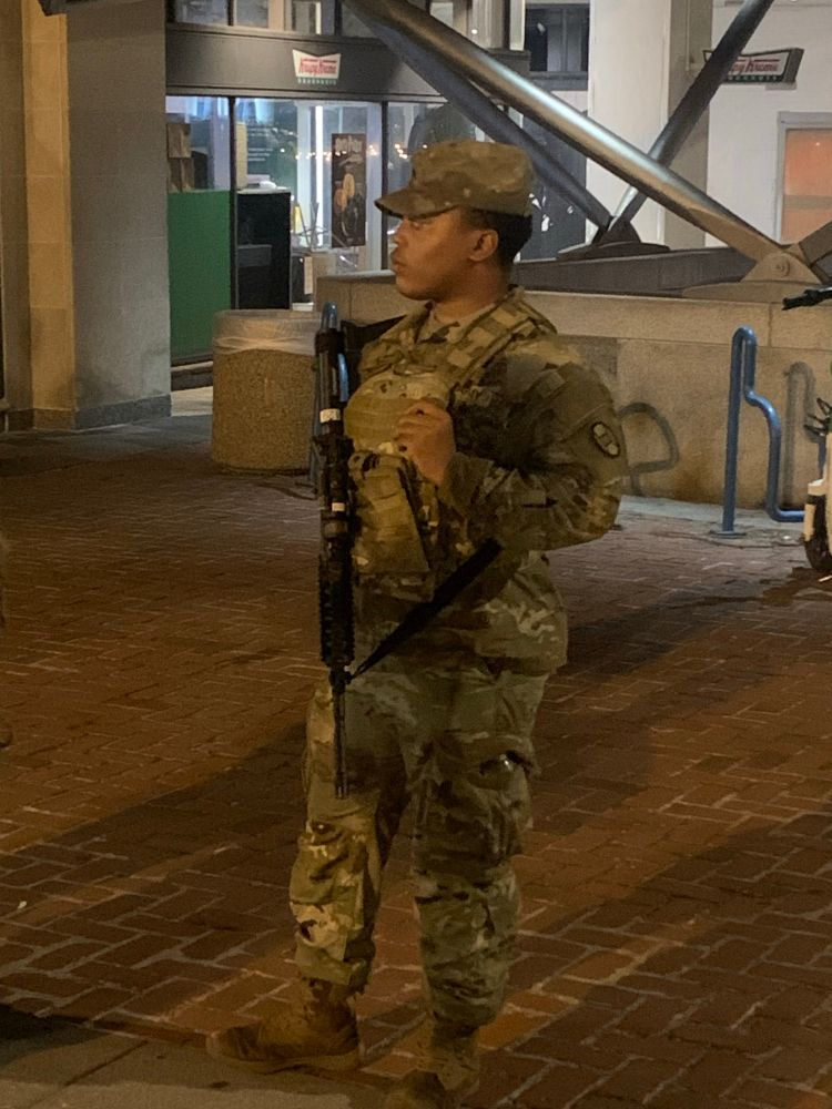 Close up of a National Guard member with an M4 carbine assault rifle. 