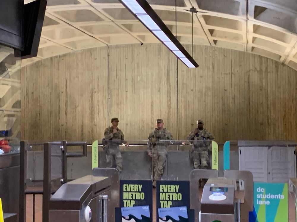 Three National Guard outside the turnstiles at Shaw/Howard U metro. 
