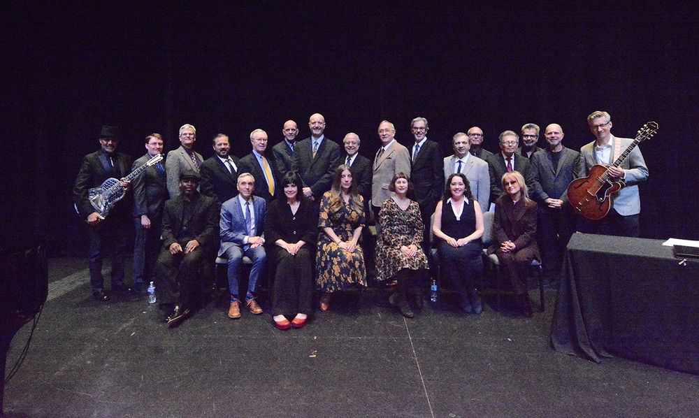 The cast of Those Were the Days' 55th anniversary event: Diamond Jim Greene and Joel Paterson (each holding their guitars) flank a group that incudes pianist Reginald Robinson, Scott Lowell, Catherine Smitko, Rachel Lichtman, Meg Guttman, Jamie Gangi, Chloe Orwell (all seated), Stuart Allard, Paul Engelhardt, Dan Gately, Karl Pearson, Dag Juhlin, Steve Darnall, Charlie Meyerson, Trace Beaulieu, Will Clinger, Rich Koz, Barry Winograd, Bob Kolososki, Jim Roche and Bill Leff (standing)