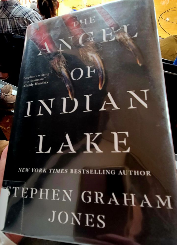 Reading The Angel of Indian Lake by Stephen Graham Jones while sitting at a small town high school basketball game. 