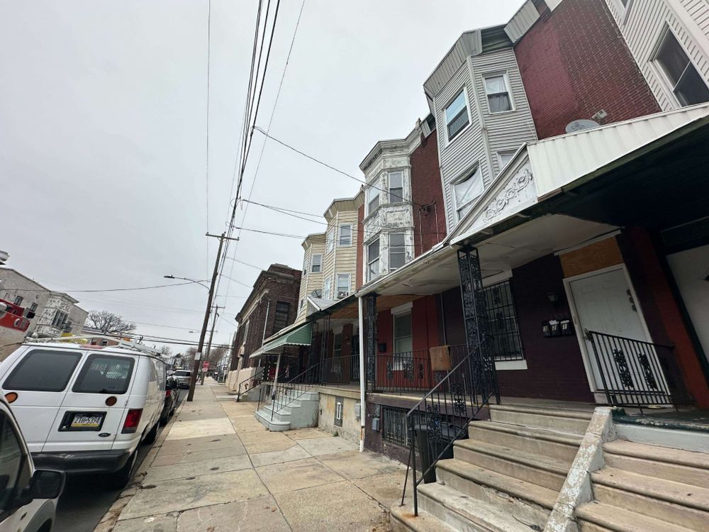 Along the 1300 block of North 60th Street in West Philadelphia's Carroll Park neighborhood is a rental property without adequate heat, according to the city's Licenses & Inspections Department records as of Dec. 24. 2024. After WHYY News contacted the property owner about the heat violations on Dec. 19, a maintenance worker was on site at the triplex.