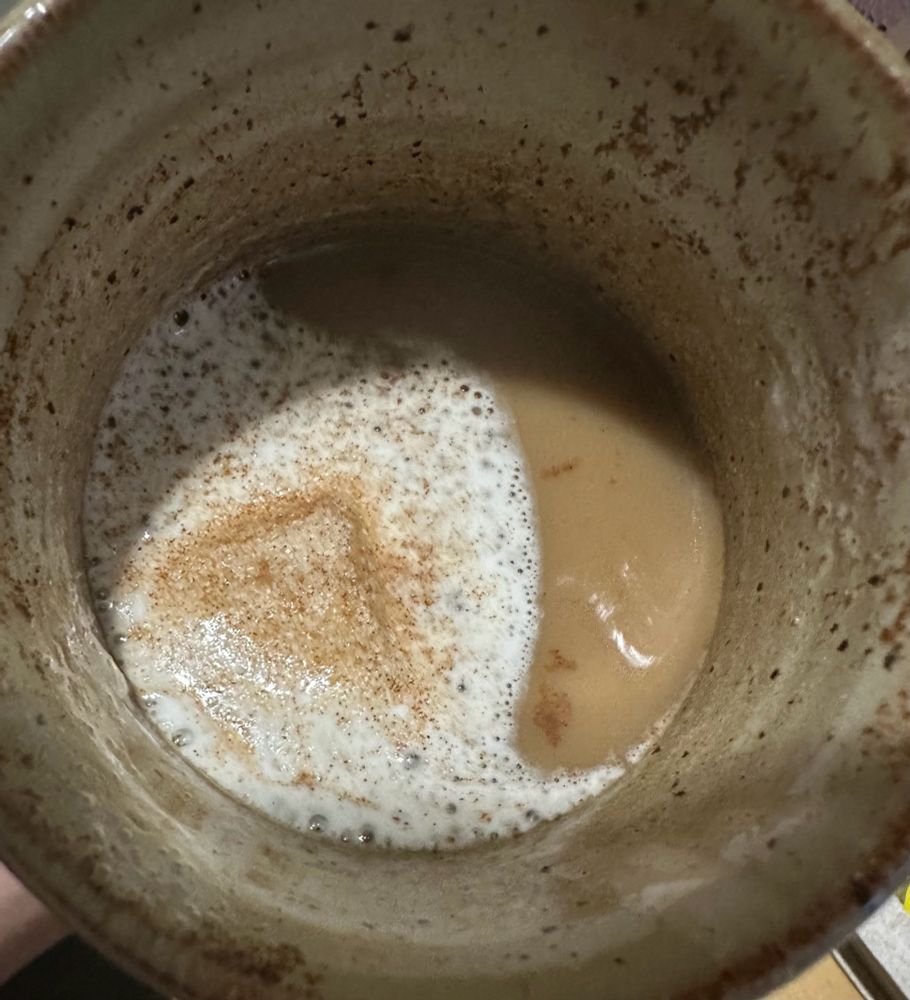 A melted marshmallow in a cup of cafe de olla coffee 