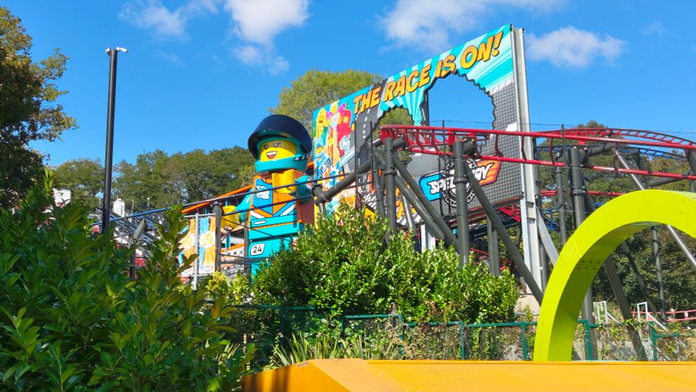 A giant mini figure and roller coaster at legoland