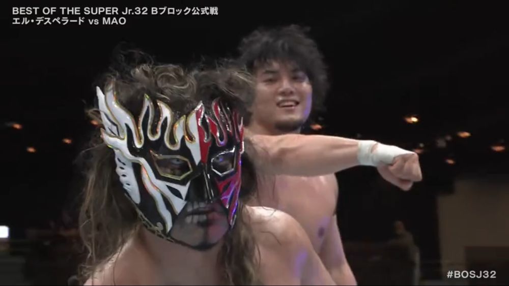 el desperado with a pissed off face in the foreground, mao lurking in the background with his fist held outward post-punch