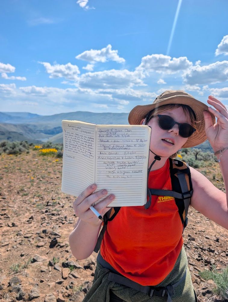 Me holding a book stop of rattlesnake dance ridge