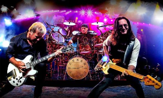 Rush (Alex Lifeson, Neal Peart, and Geddy Lee) in concert.