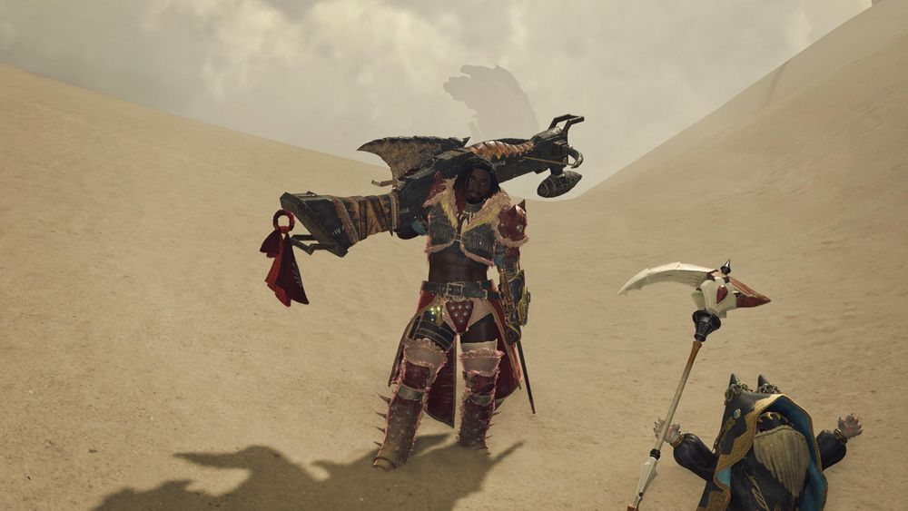 My hunter in Monster Hunter Wilds holding a bowgun over the shoulder with my palico cat in the desert
