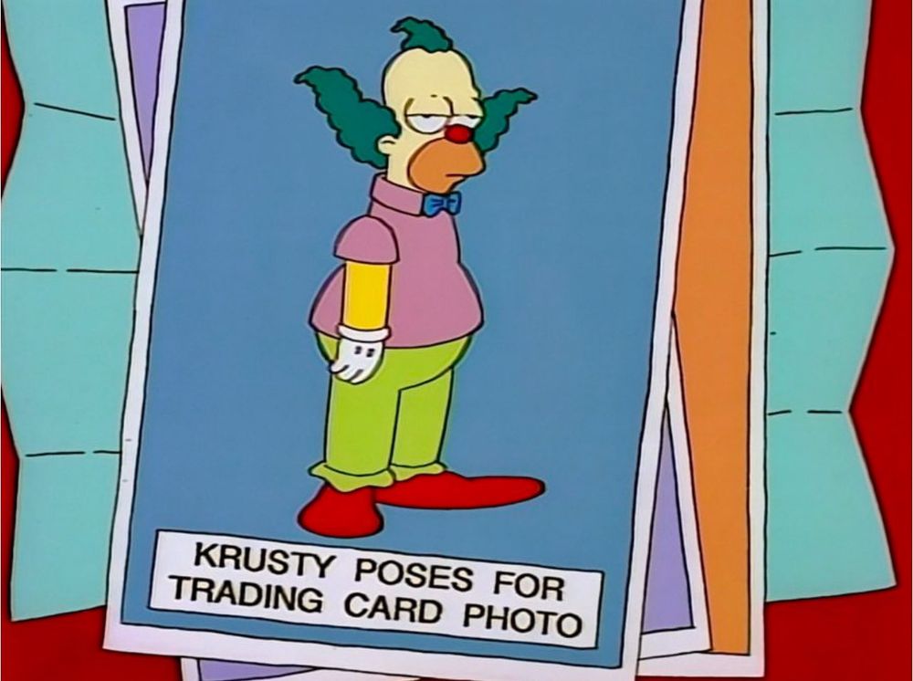 Screenshot of a Simpsons episode, of a Krusty the Clown trading card with him standing around, looking disinterested, with the caption on the card reading: “Krusty poses for trading card photo” 