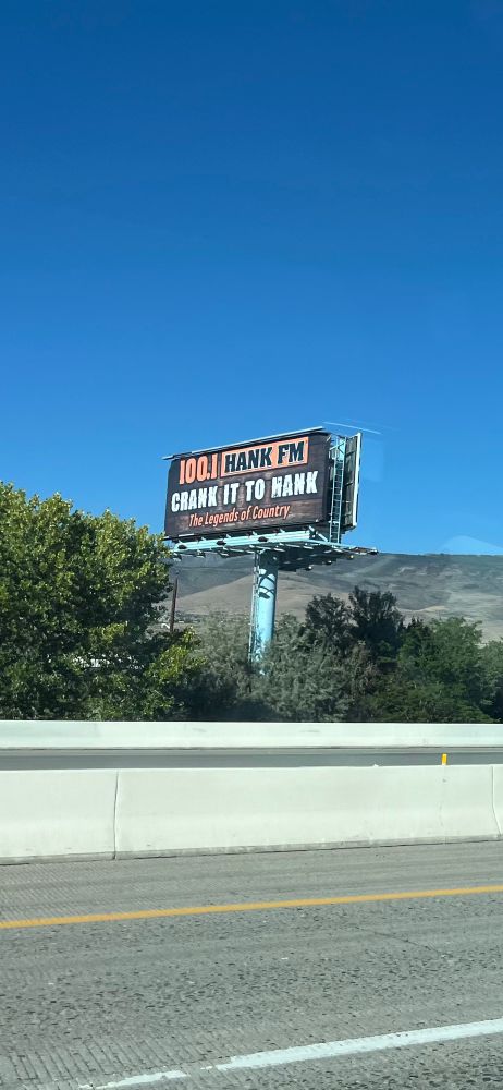 Billboard that says “crank it to Hank” 