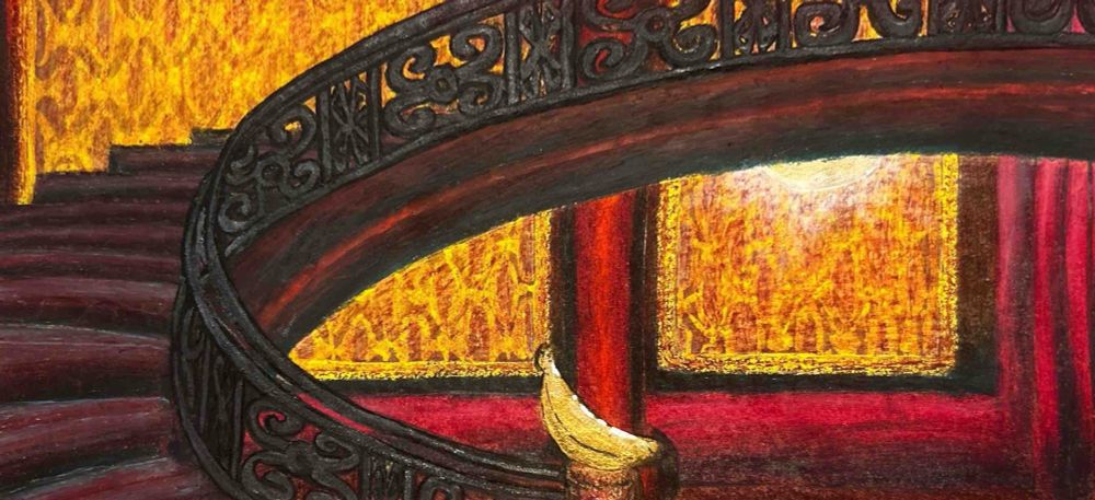 An interior view of Easel and Palette’s 2-story mansion home. There are crimson walls with pillars, and between those pillars are accent gold and crimson Persian patterns, with one them having a wall light. A maroon staircase with a crimson base is seen on the left, with black steel railings, with a gold, banana-shaped top at the entrance to the staircase. 