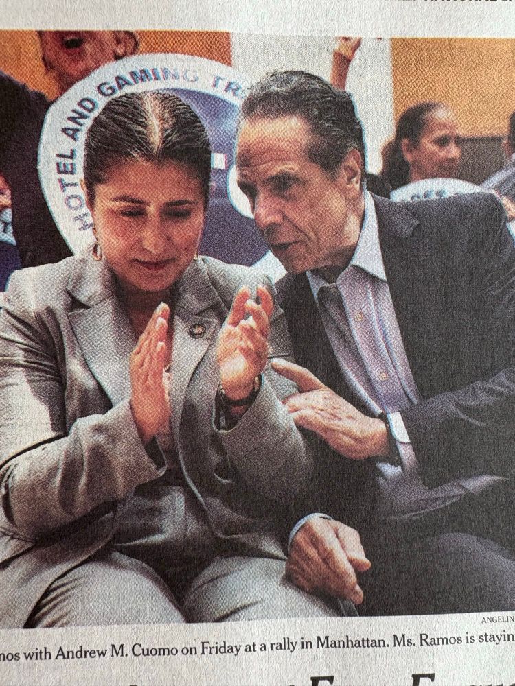 A photo of sex pest Andrew Cuomo leaning in close to talk to Jessica Ramos, after she sold out and endorsed him. Cuomo’s right hand is half resting on top of her left leg, and his left hand is touching her arm.