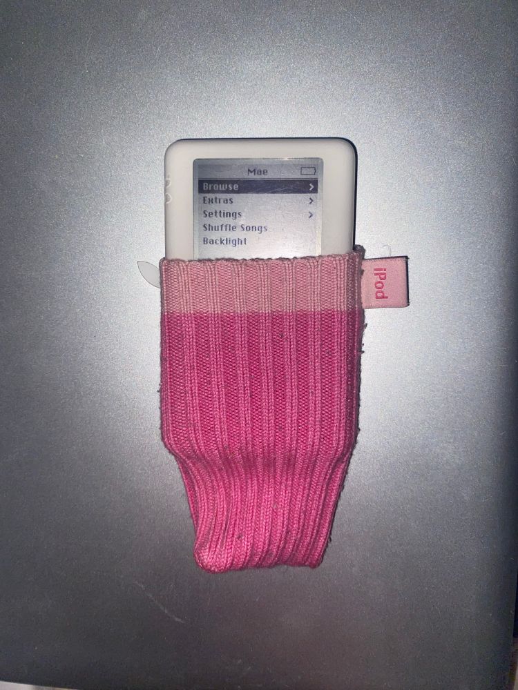 A modified 4th Generation iPod (Monochrome) peeking out of a pink iPod Sock