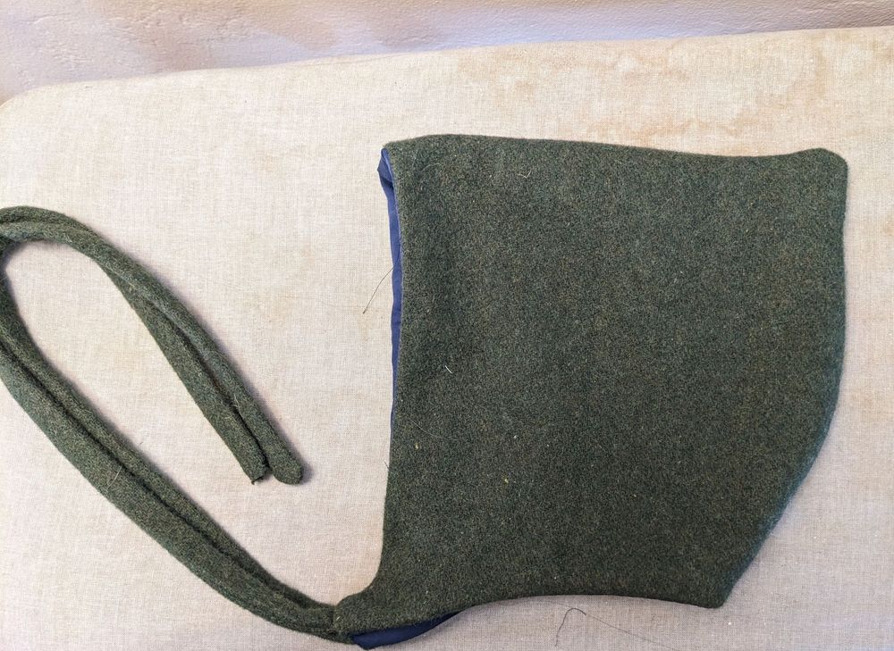 Dark green wool pixie hat.