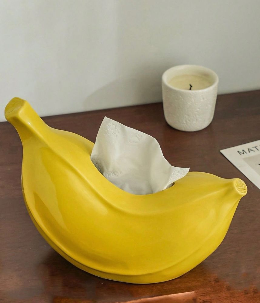 A fabulous tissue box in the shape of a chubby banana. I really want it.