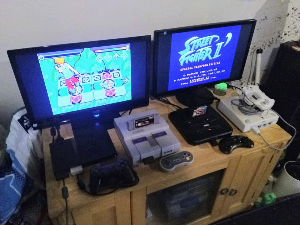 Four retro gaming systems and 2 TV's
