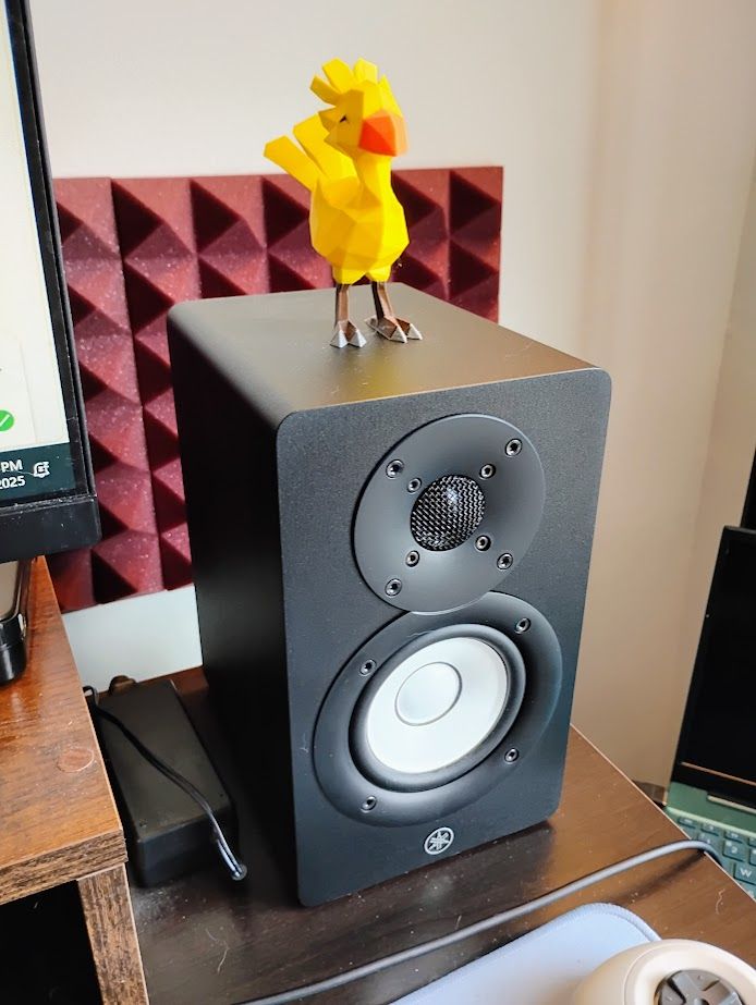 A chocobo sits atop a speaker