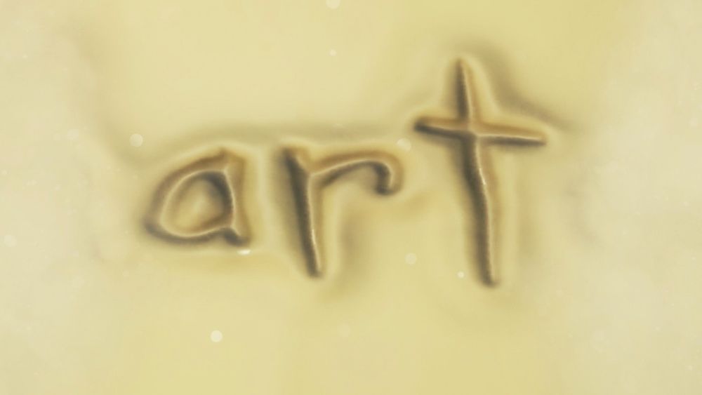 the word art, but it's written in the sand.