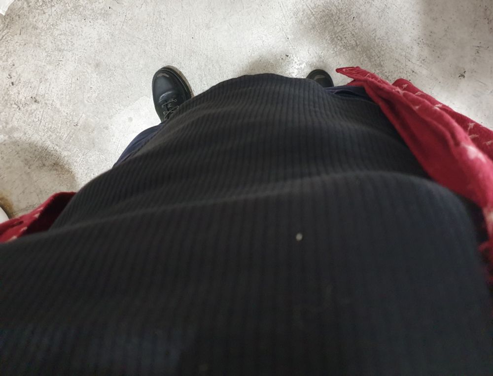 Point of view show of me looking down at my tight-ish black shirt. There is a very noticeable drop on my chest under where my tits end.