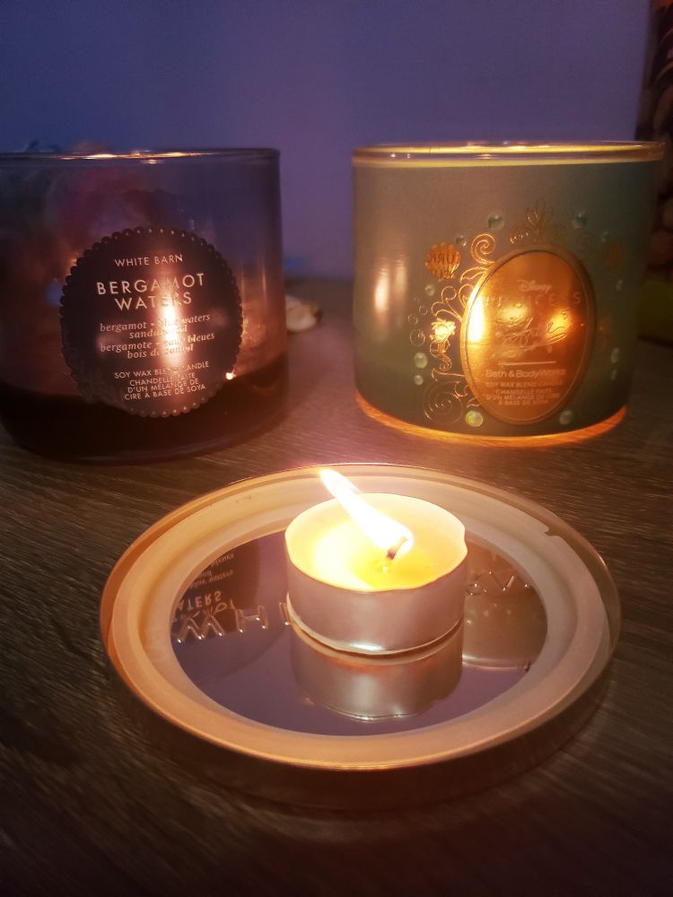 Two large candles, and one tea light sized candle, burn happily on my desk. But they don't burn my desk. So far.