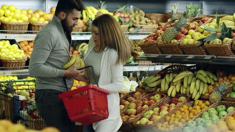 Two people bumping into each other at a supermarket