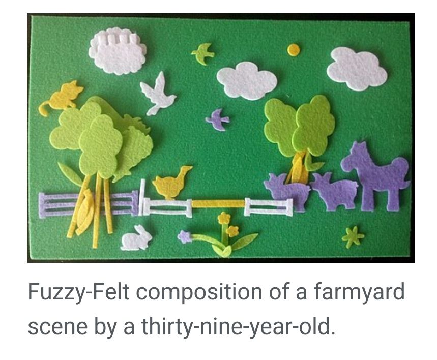A tidy farmyard scene made in Fuzzy-Felt shapes and the caption "Fuzzy-Felt composition of a farmyard scene by a thirty-nine-year-old."