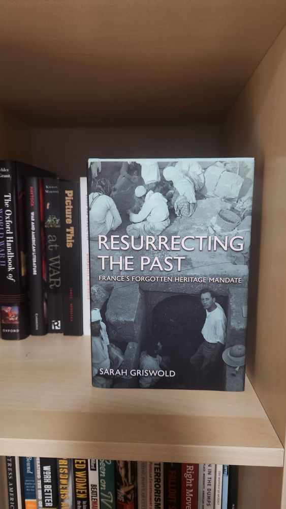 Cover of book on bookshelf.