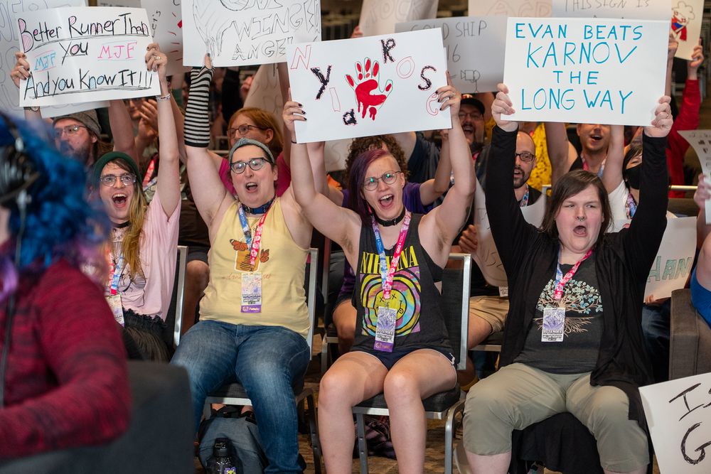 AEW crowd holding up signs 