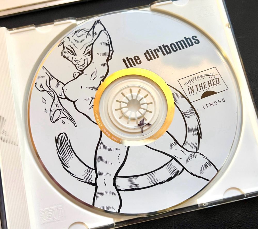 CD art of the musical group "The DirtBombs"'s "Horndog Fest", with a funny animal character.