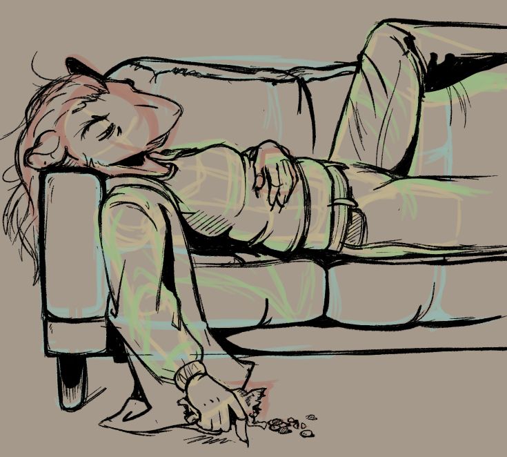Ivelyn crashed out on a couch looking sad and/or sick.  In her left hand she's holding a half eaten bag of chocolate candies.