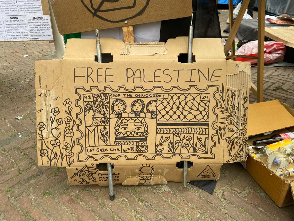 Free Palestine sign on cardboard with beautiful ornaments and designs 