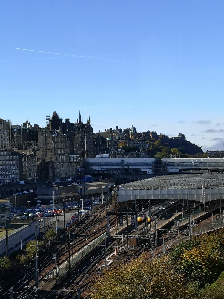 It's like the post says, a view of Edinburgh Waverley station, the old town and castle with bright blue sky