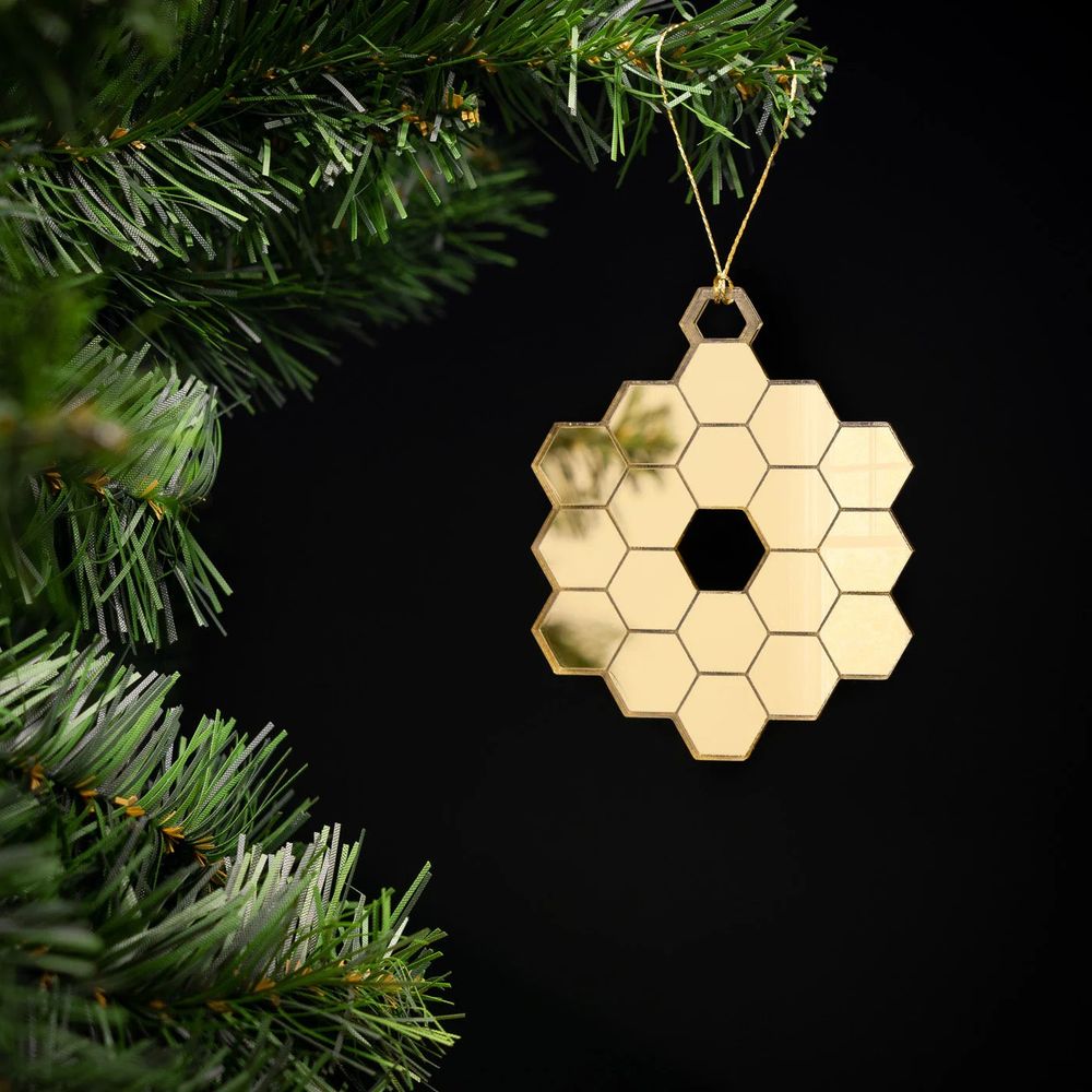 JWST holiday ornament hanging in tree
