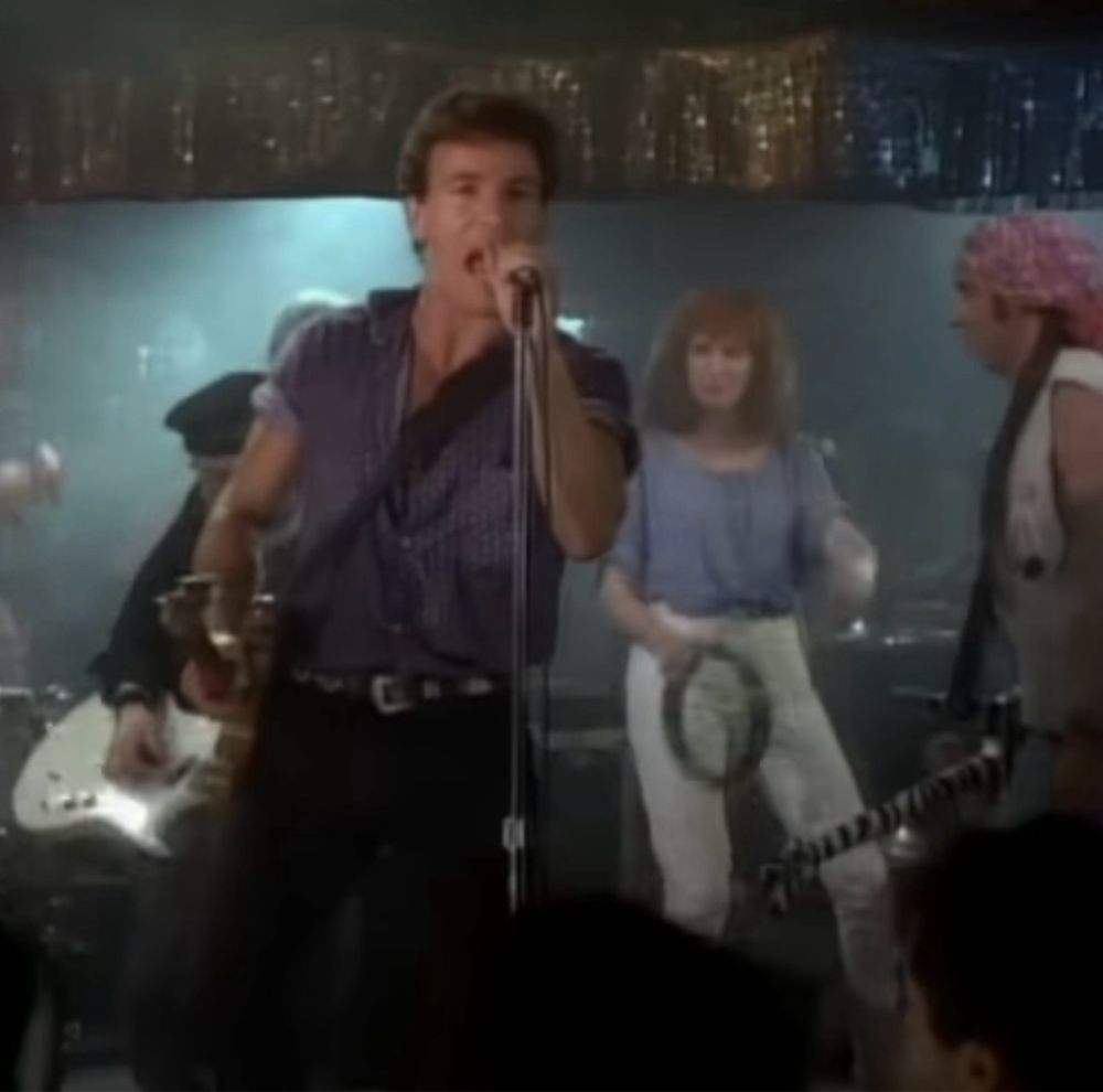 Bruce Springsteen, Nils Lofgren, Patti Scialfa, and Little Steven Van Zandt performing in the glory days video. Because Nils and Patti were added to the band when Stevie left, this was, I believe, the only time for years that the band existed with all three of them - as well as Garry Tallent, Max Weinberg, Roy Bitten, Danny Federici, and Clarence Clemons.  The stage is so small and the band so large that it’s hard to get an image where you can see everyone, even just the three members that make this configuration unusual. 