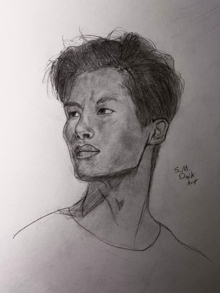Pencil portrait of a male Asian model looking towards his right 