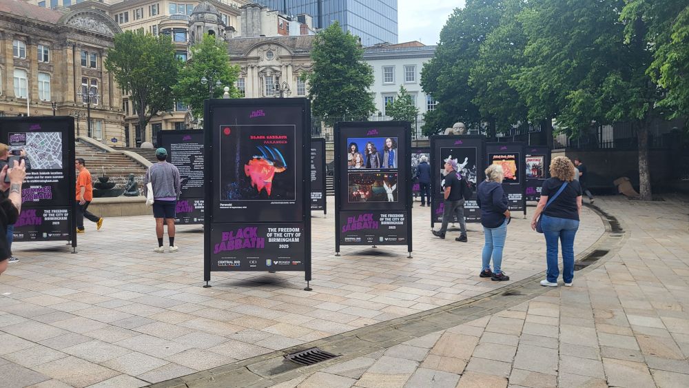 Multiple free-standing boards depicting information about Black Sabbath's various albums