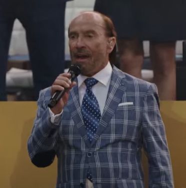 Lee Greenwood at the parade tonight, wearing a blue and white print jacket.