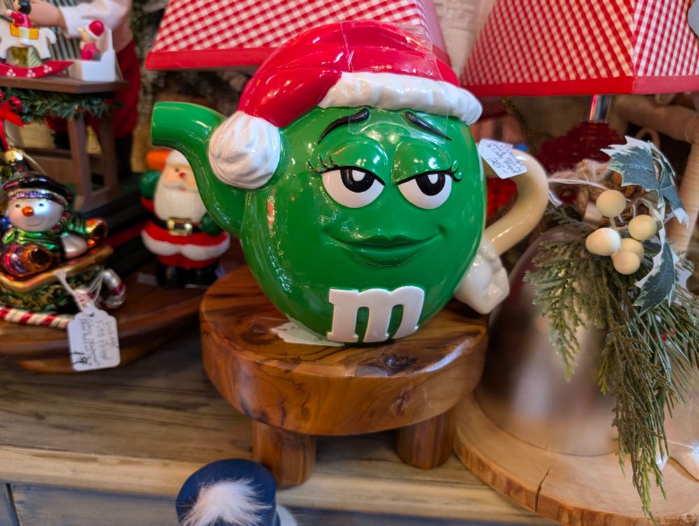 A porcelain green M&M teapot