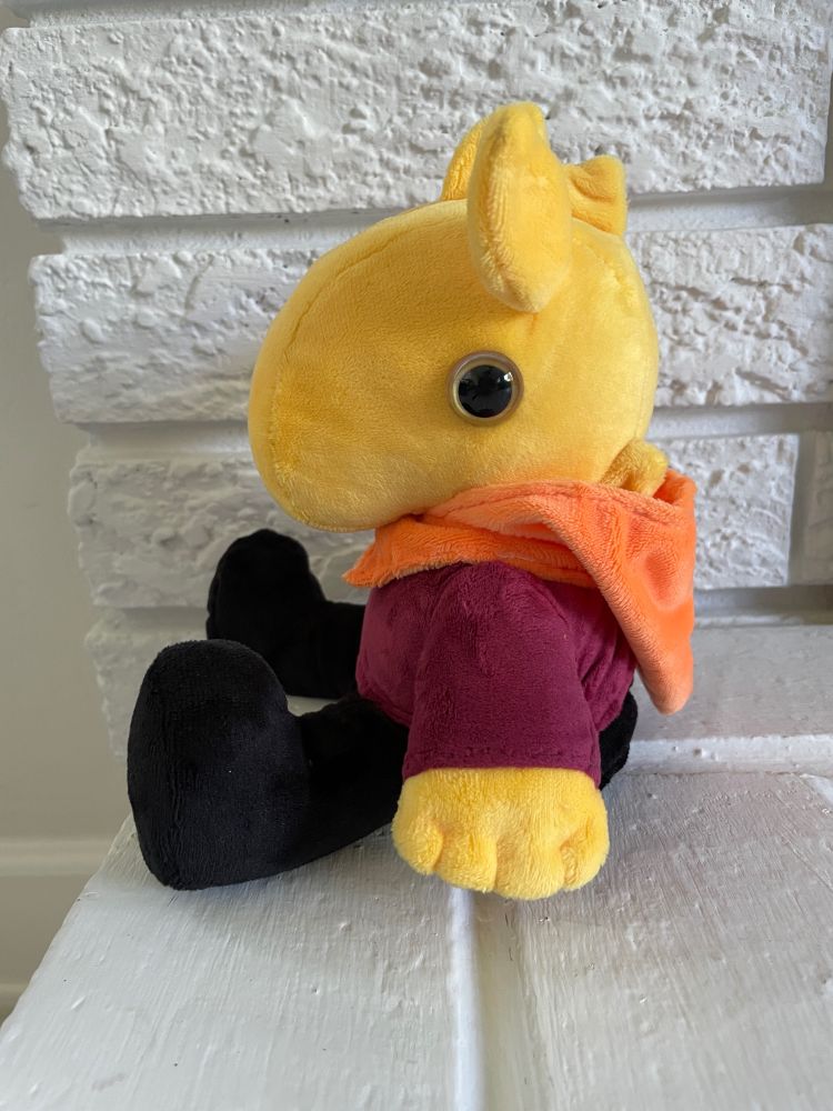 plushie of my character worm from garbageland, looks like a yellow tapir in peasant clothing