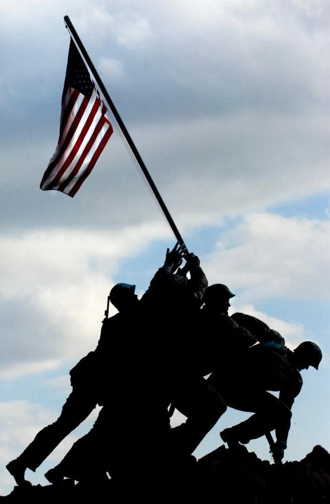 Image of a statue of soldiers putting up a flag.