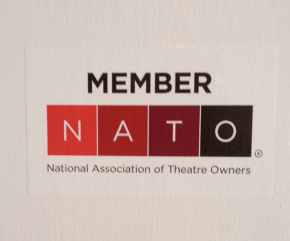 Sticker reading " Member NATO, National Association of Theatre Owners"