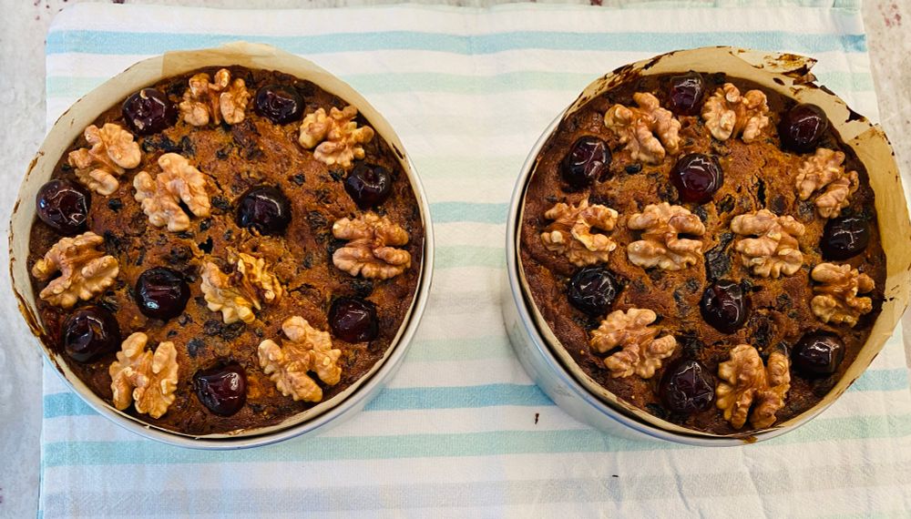 Two Christmas cakes just out of the oven. 