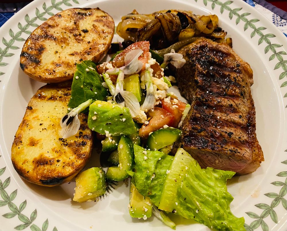 Steak, salad, potato & onion