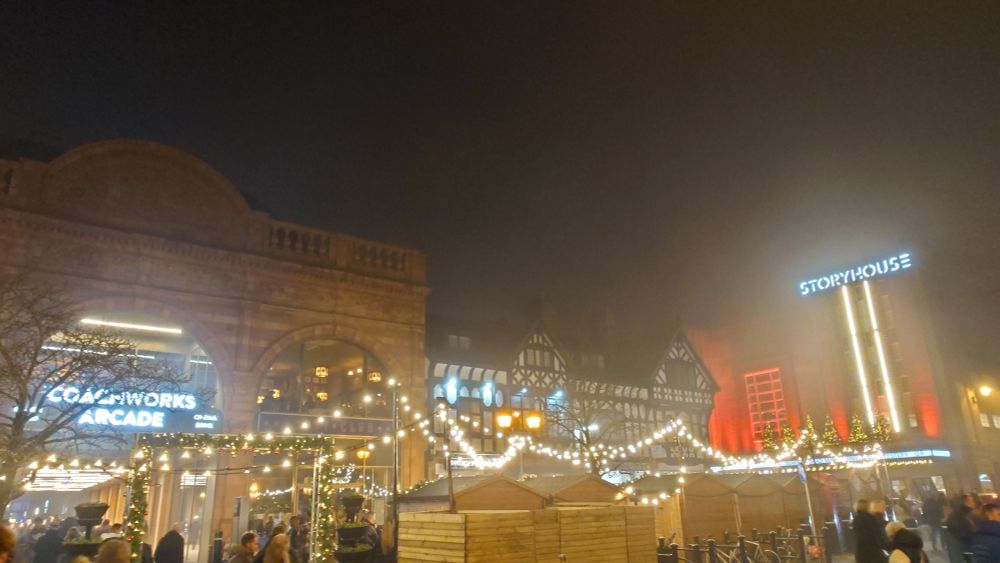 The coachworks arcade, the xmas market fairy lights and storyhouse, all illuminated and glowing in the fog
