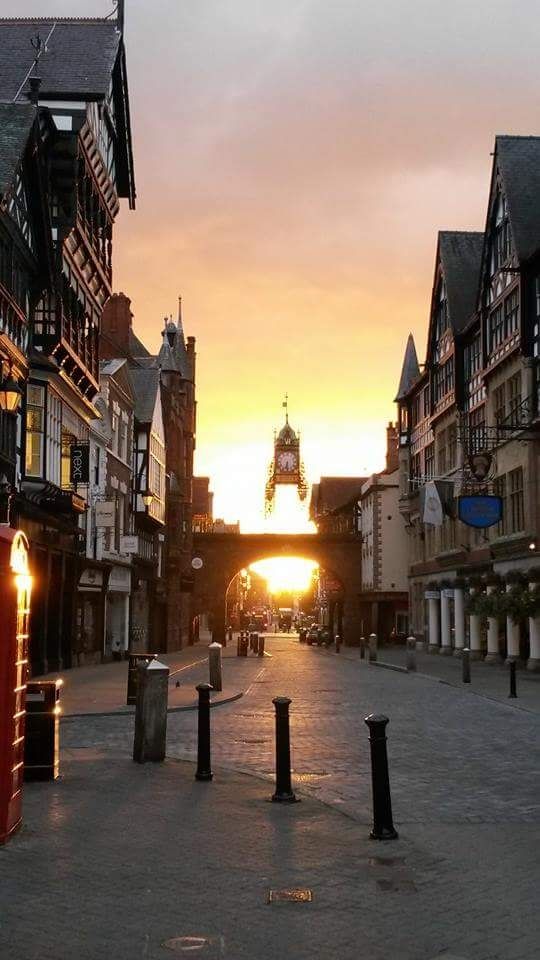Sun rising behind Chester's Foregate and its famous clock