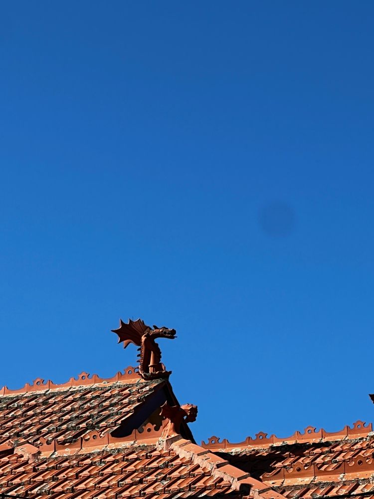 A terracotta finial in the shape of a dragon 