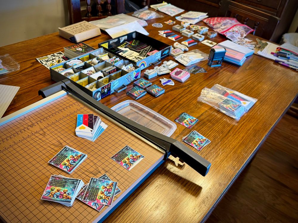 Photo of a table filled with various stickers and mailing items.