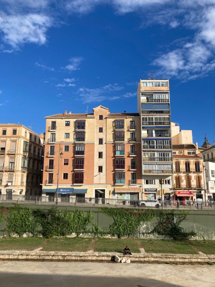 View of buildings, river bank and sky in Málaga. Especially aimed at my friends stick in miserable Berlin 
