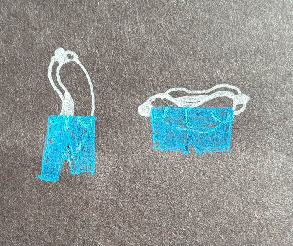 a photo of a drawing of two hot dogs; one is upright, on the left, wearing pants coming from the middle of the bun going down. the other, on the right, is horizontal, and has pants that look like shorts coming from the middle of the dog